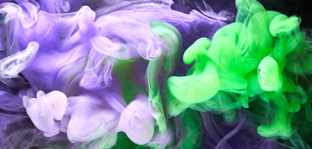 Green purple smoke abstract background acrylic paint underwater explosion