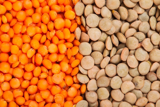 Green and red lentils heap as a background