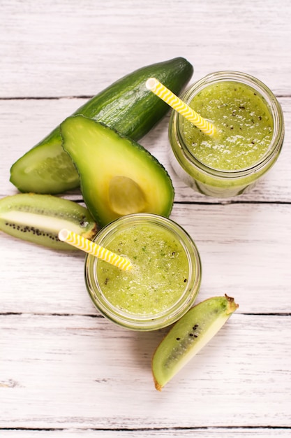 Green refreshing smoothie with kiwi, cucumber and apples