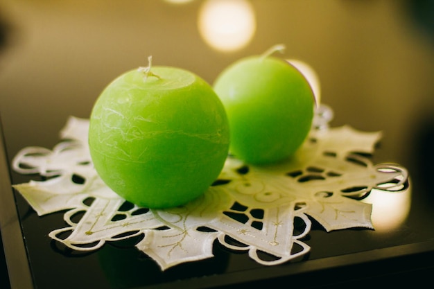 green round candles stand on the windowsill, interior decor, close-up