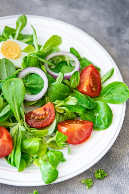 green salad egg, vegetable  tomato, onion, leaves lettuce mix fresh healthy meal food snack