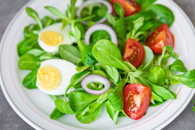 green salad egg, vegetable  tomato, onion, leaves lettuce mix fresh healthy meal food snack