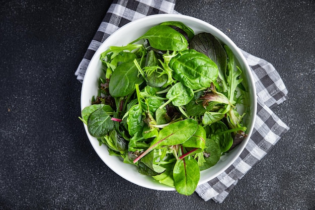 green salad leaves mix micro green, juicy healthy snack food on the table copy space food