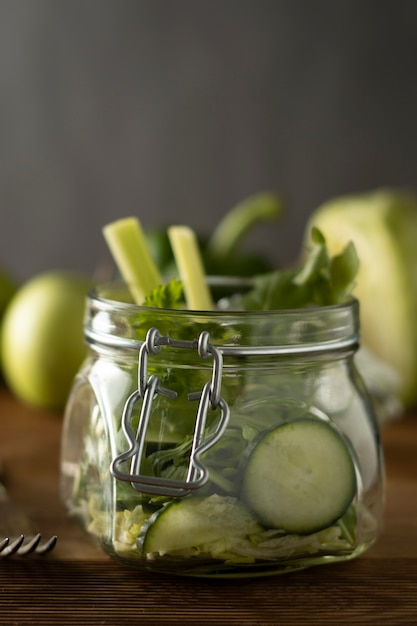 Green salad packed in mason jar. Healthy, homemade, take away food. Copy space.