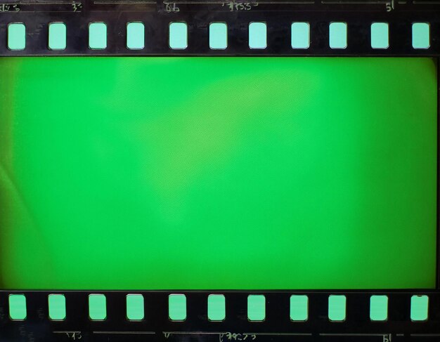 Green screen loop footage of old negative film strip frame