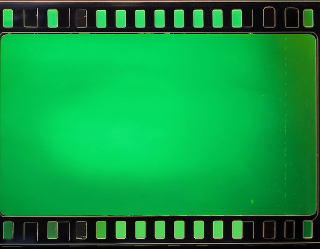 Green screen loop footage of old negative film strip frame