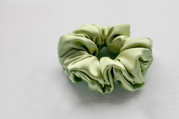 Green silk Scrunchy isolated on white background