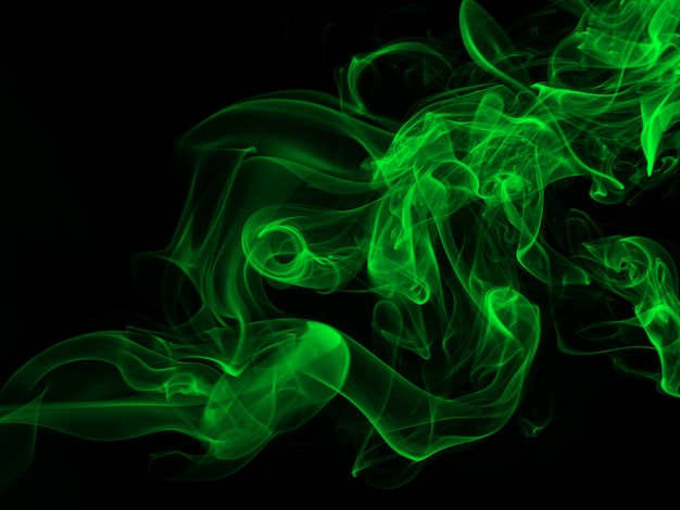 Green smoke abstract on black backgroud, darkness concept