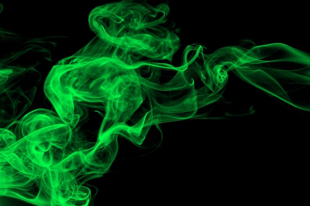 Green smoke abstract on black background darkness concept