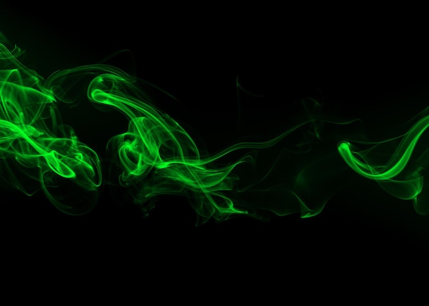 Green smoke on black background darkness concept