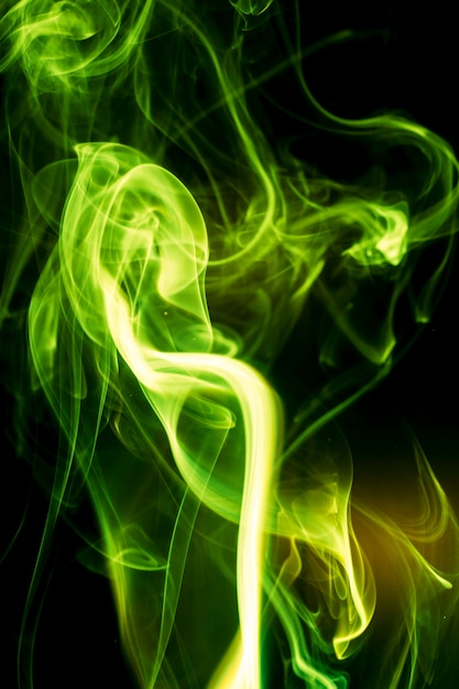 Green smoke on black background.