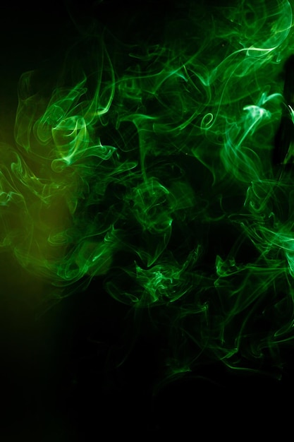 Green smoke motion on black background