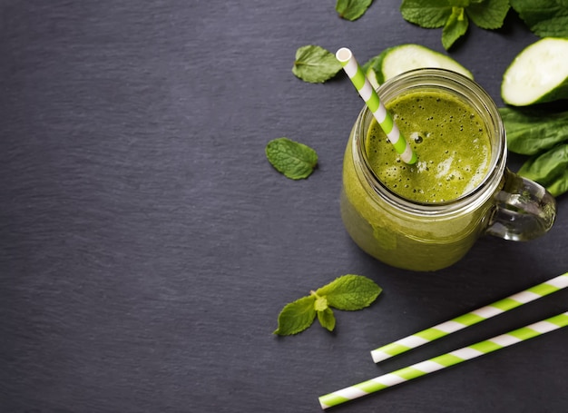 Green smoothie in a glass jar top view