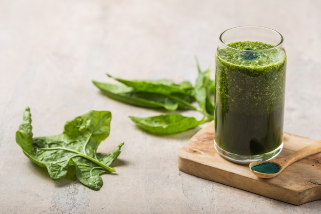 Green smoothie with spirulina. Young barley and chlorella spirulina. Detox superfood.