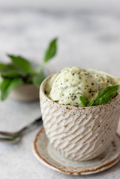 green spinach coconut ice cream in ceramic bowl healthy vegan dessert