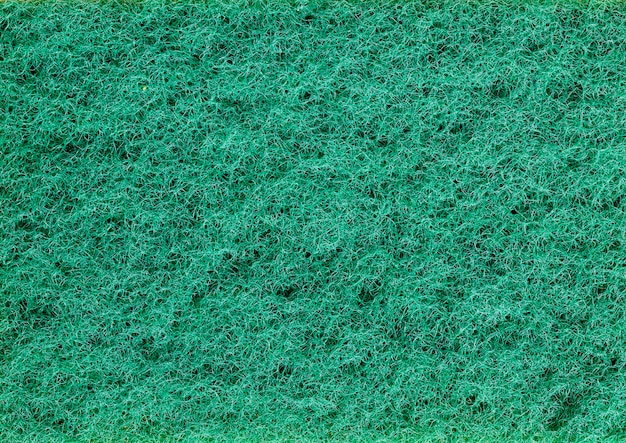 Green sponges for washing dishes and other items, close-up of kitchen sponges