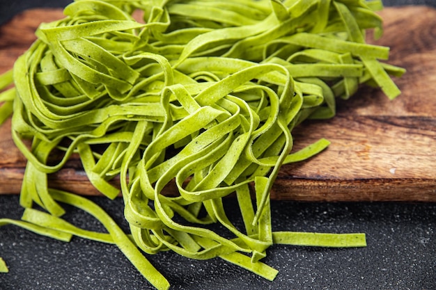 green tagliatelle raw pasta basil second course vegetable food healthy meal food snack