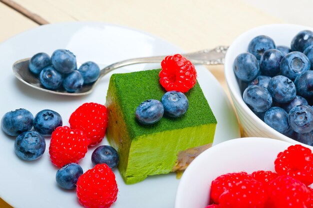 Green tea matcha mousse cake with berries