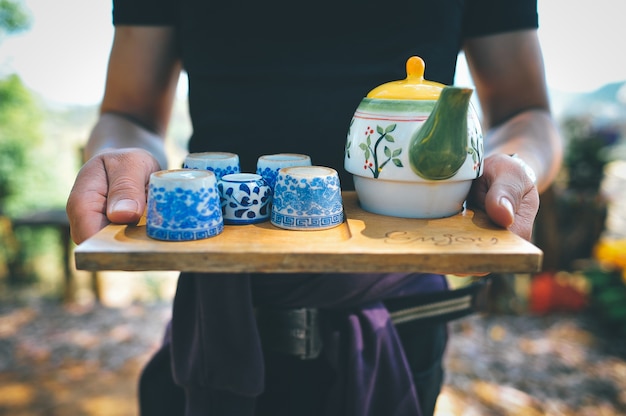 Green tea and men's hand