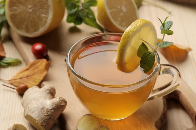 Green tea with lemon and cinnamon in a glass cup