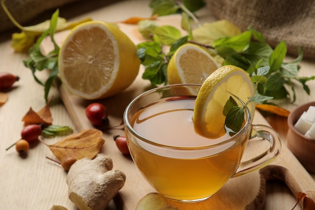 Green tea with lemon and cinnamon in a glass cup