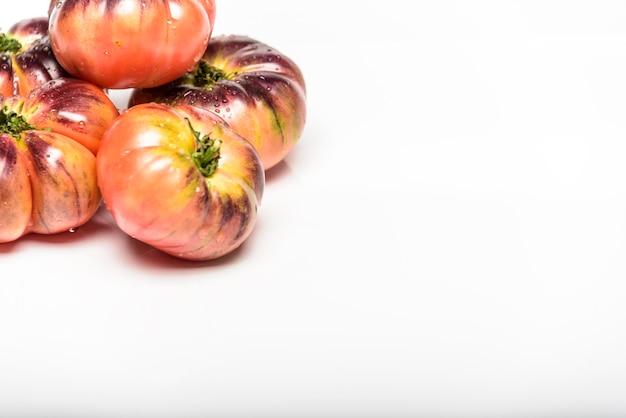 Green Tiger tomatoes isolated on white top view