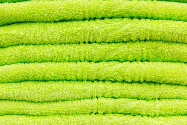 Green towels in the hotel. Texture of green towels