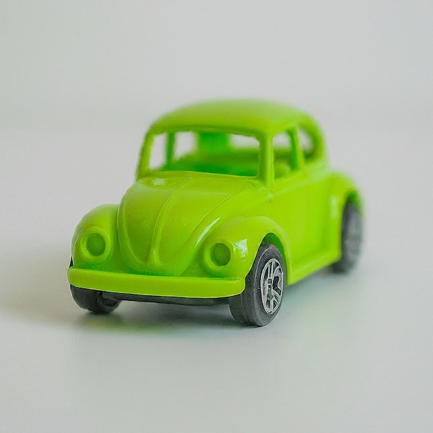 a green toy car with the word quot vw quot on the front