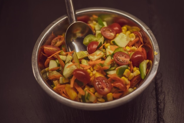 Green vegan salad from green leaves mix and vegetables