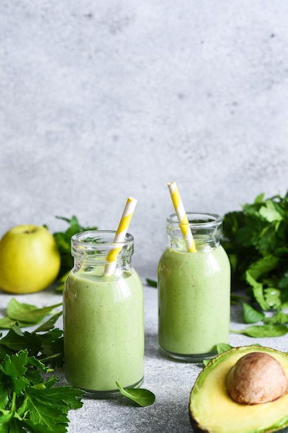 Green vegetable smoothie with parsley celery and avocado