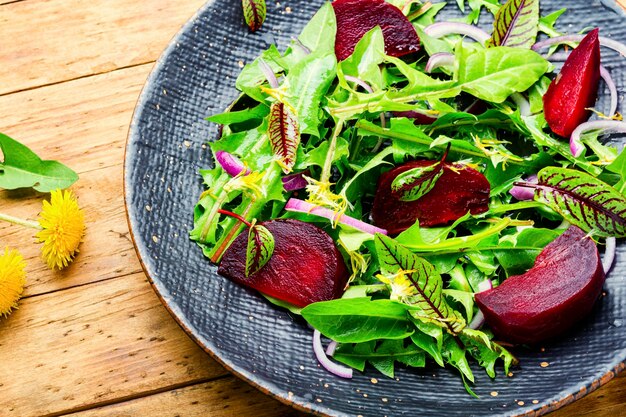 Photo green vegetarian salad made from beets and greens.vegan menu.