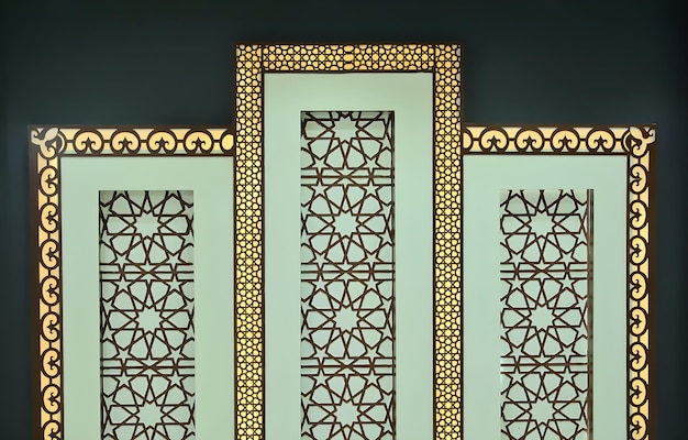 A green wall with a gold frame and the text ramadan