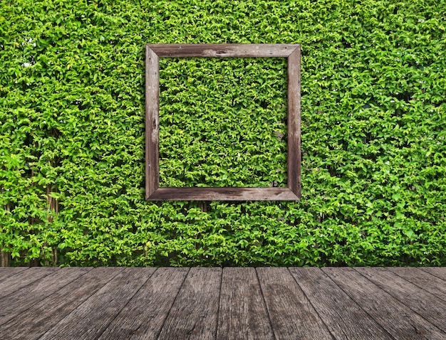 Photo a green wall with a wooden frame and a wooden frame