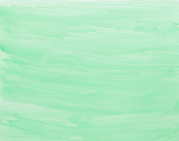 Green watercolor background hand painted by brush