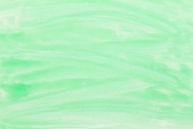 Green watercolor background hand painted by brush