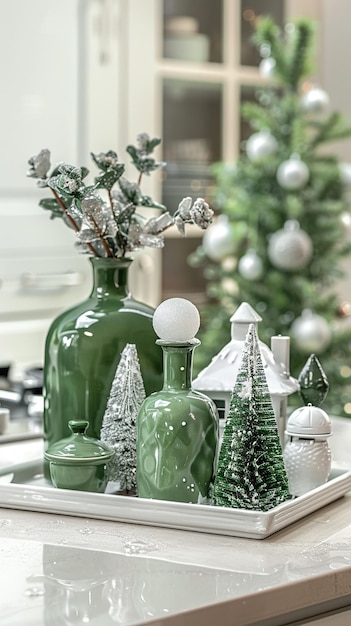 Green and white holiday decorations with a green vase and ornaments