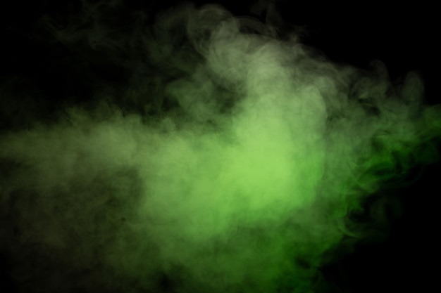 Green and white steam on a black background