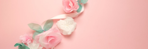 Greeting card with paper flowers rose banner background.