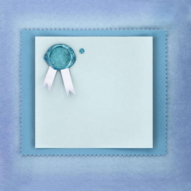 Photo greeting paper card with sealing wax stamp on blue background