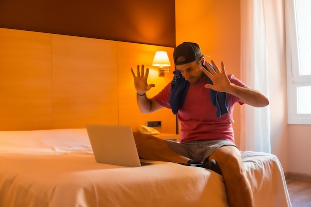 Greeting the teacher online on the computer from her bedroom