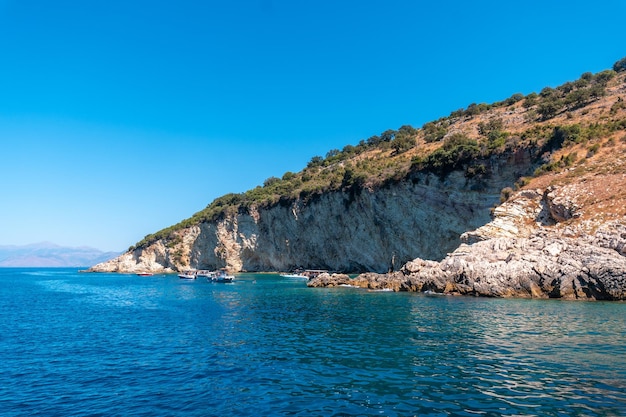 Gremina beach seen from the boat on the Albanian riviera near Sarande turquoise sea water