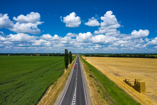 Grey asphalted narrow country road aerial view