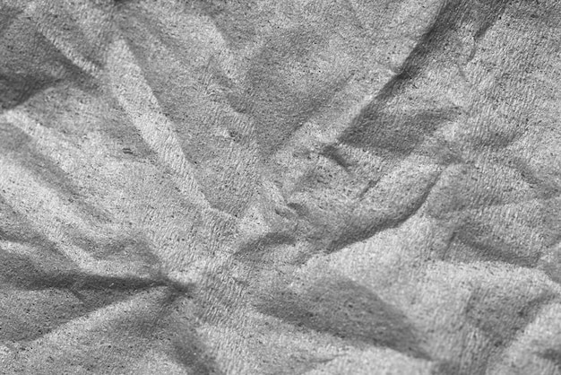 Grey crumpled paper textured background