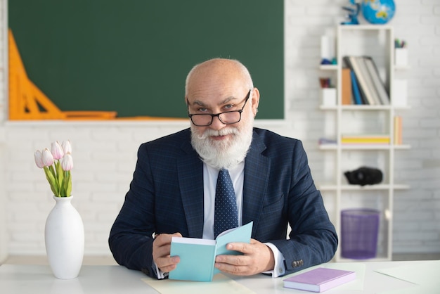 Grey hair professor in empty lecture classroom School teacher or college and university lecture