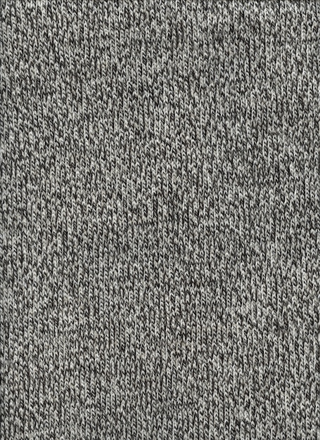 Grey mottled wool texture background. Close up fabric wallpaper