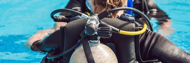 Grey scuba diving air oxygen tank on the back of a scuba diver banner long format