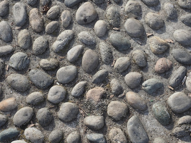 Grey stone pebbles texture background