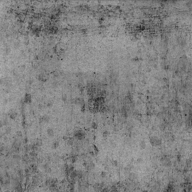 Photo a grey wall with a dark gray background with a dark spot on it