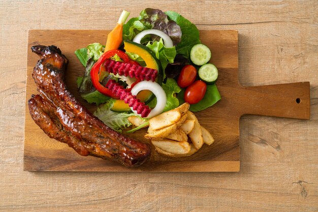 grill barbecue pork spare ribs with vegetables