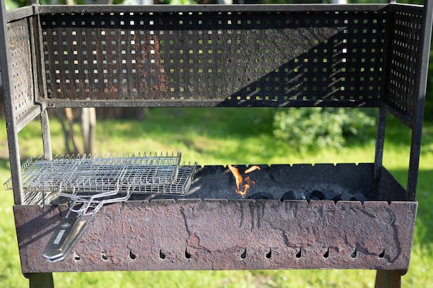 Grill for grilling on the grill with charcoal and fire